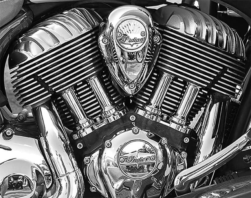 Close-up of a chromed Indian motorcycle V-twin engine, symmetrical, black and white